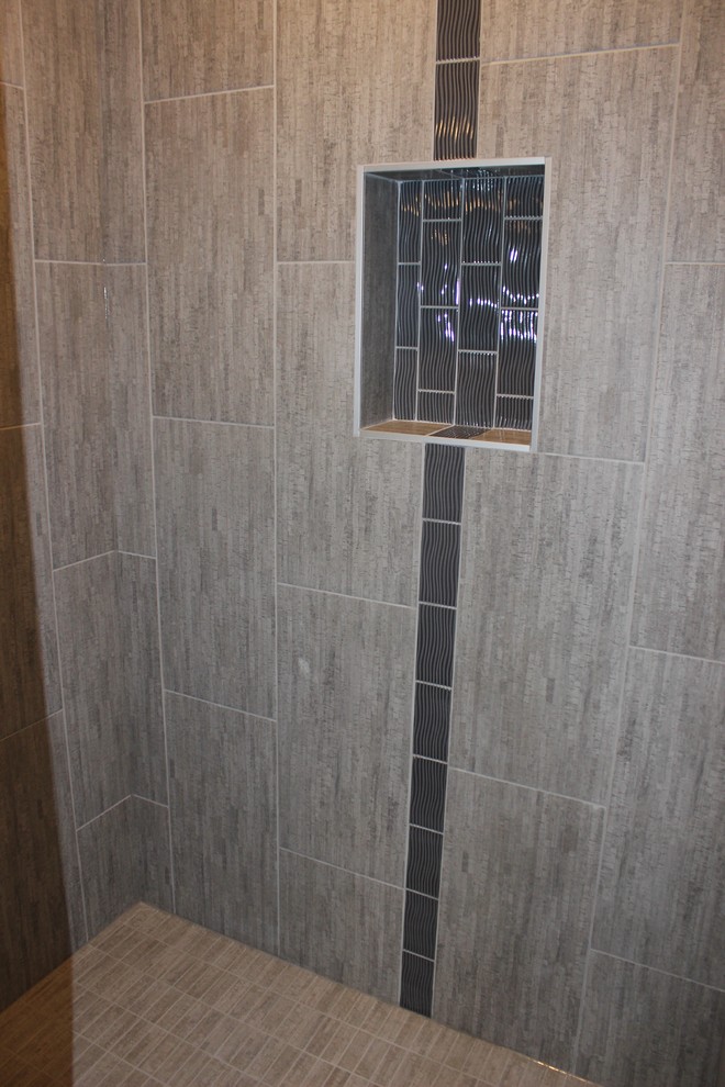 Bathroom - transitional gray tile and mosaic tile ceramic tile bathroom idea in Other with shaker cabinets, dark wood cabinets, granite countertops and beige walls