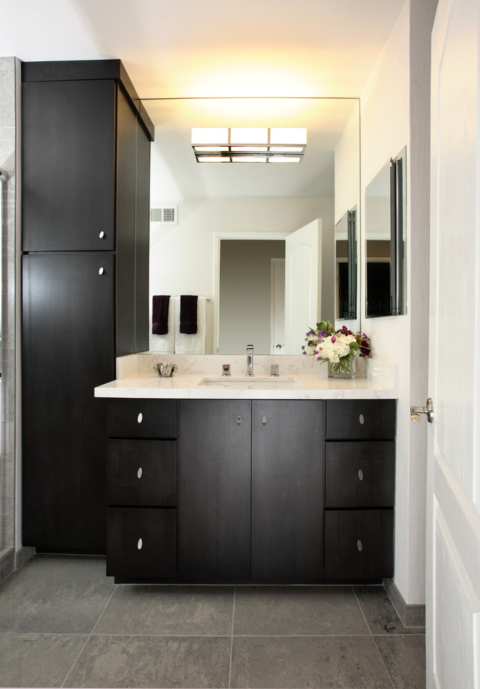 Example of a trendy gray tile and ceramic tile alcove shower design in San Francisco with an undermount sink, flat-panel cabinets, dark wood cabinets, quartzite countertops and a two-piece toilet