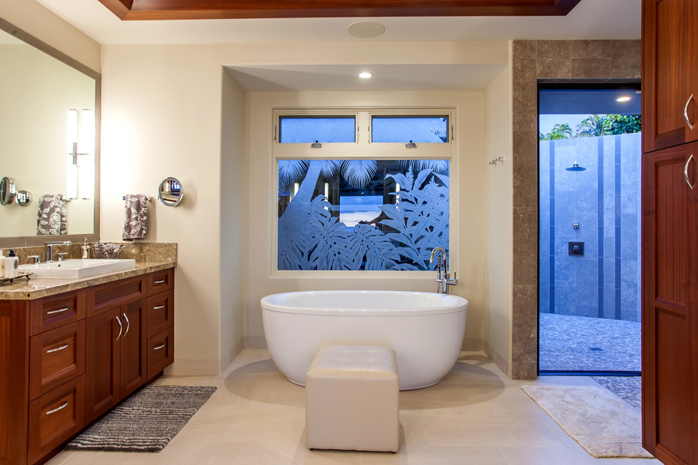 Example of an island style master bathroom design in Hawaii with shaker cabinets, medium tone wood cabinets and marble countertops