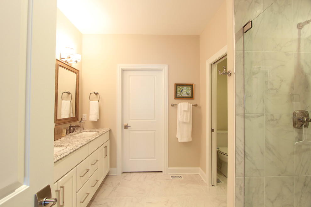 Walk in Closet Off Master Bathroom with Marble Floors Traditional