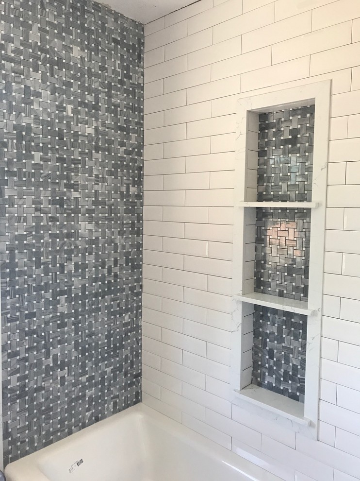Design ideas for a small classic shower room bathroom in Los Angeles with shaker cabinets, a corner bath, a shower/bath combination, a one-piece toilet, grey walls, porcelain flooring, engineered stone worktops, grey floors, a sliding door, blue cabinets, blue tiles, glass sheet walls and a vessel sink.