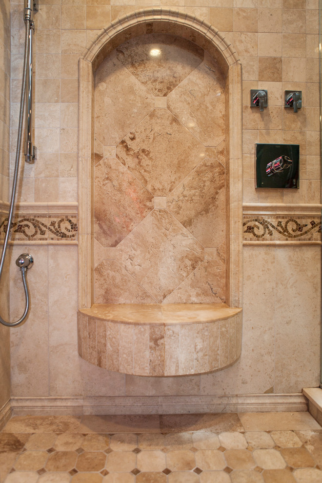 На фото: большая главная ванная комната в классическом стиле с врезной раковиной, фасадами островного типа, темными деревянными фасадами, угловым душем, бежевой плиткой и керамической плиткой с