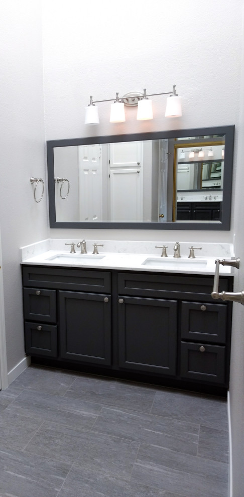 Inspiration for a mid-sized transitional master blue tile and glass sheet ceramic tile and gray floor alcove shower remodel with raised-panel cabinets, gray cabinets, a one-piece toilet, gray walls, an undermount sink, quartz countertops and a hinged shower door
