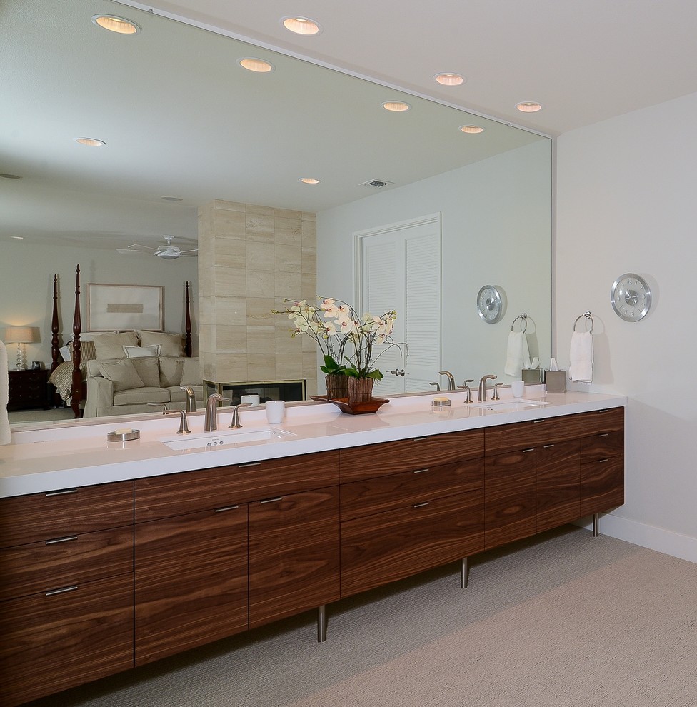 Inspiration for a modern master bathroom remodel in Sacramento with flat-panel cabinets, dark wood cabinets and an undermount sink