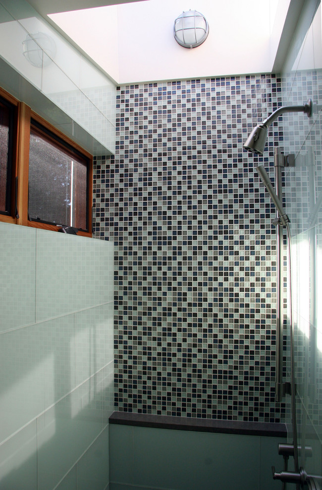 Photo of a contemporary bathroom in Seattle with mosaic tiles.