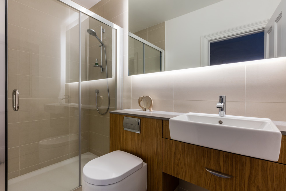 Design ideas for a small contemporary shower room bathroom in London with flat-panel cabinets, medium wood cabinets, a built-in shower, a one-piece toilet, beige tiles, porcelain tiles, porcelain flooring, an integrated sink, engineered stone worktops, beige floors, a sliding door and white walls.