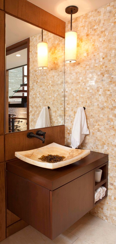 На фото: ванная комната в современном стиле с плоскими фасадами, темными деревянными фасадами, разноцветной плиткой, плиткой мозаикой, оранжевыми стенами, полом из керамогранита, душевой кабиной, накладной раковиной, столешницей из дерева, белым полом и коричневой столешницей с