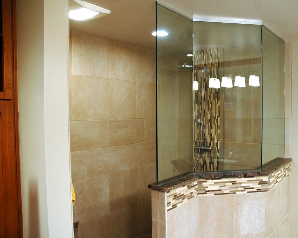 This is an example of a traditional bathroom in Chicago with a submerged sink, recessed-panel cabinets, medium wood cabinets, granite worktops, a walk-in shower, a one-piece toilet, brown tiles and porcelain tiles.