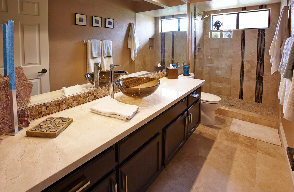 Medium sized classic shower room bathroom in San Diego with shaker cabinets, dark wood cabinets, a built-in shower, beige tiles, brown tiles, glass tiles, brown walls, travertine flooring, a vessel sink, beige floors and an open shower.