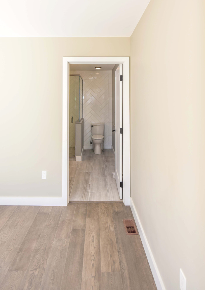 Medium sized contemporary shower room bathroom in Toronto with shaker cabinets, dark wood cabinets, a corner shower, a two-piece toilet, white tiles, metro tiles, grey walls, vinyl flooring, concrete worktops, a hinged door and grey floors.