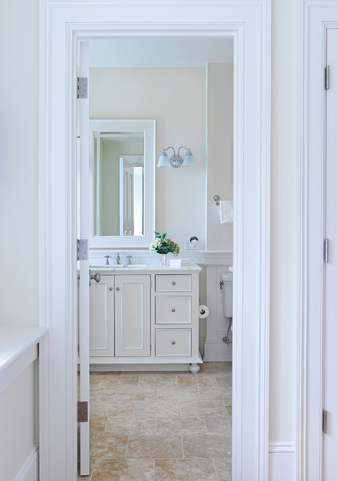 Large traditional bathroom in Boston with beaded cabinets, white cabinets, marble worktops and marble flooring.