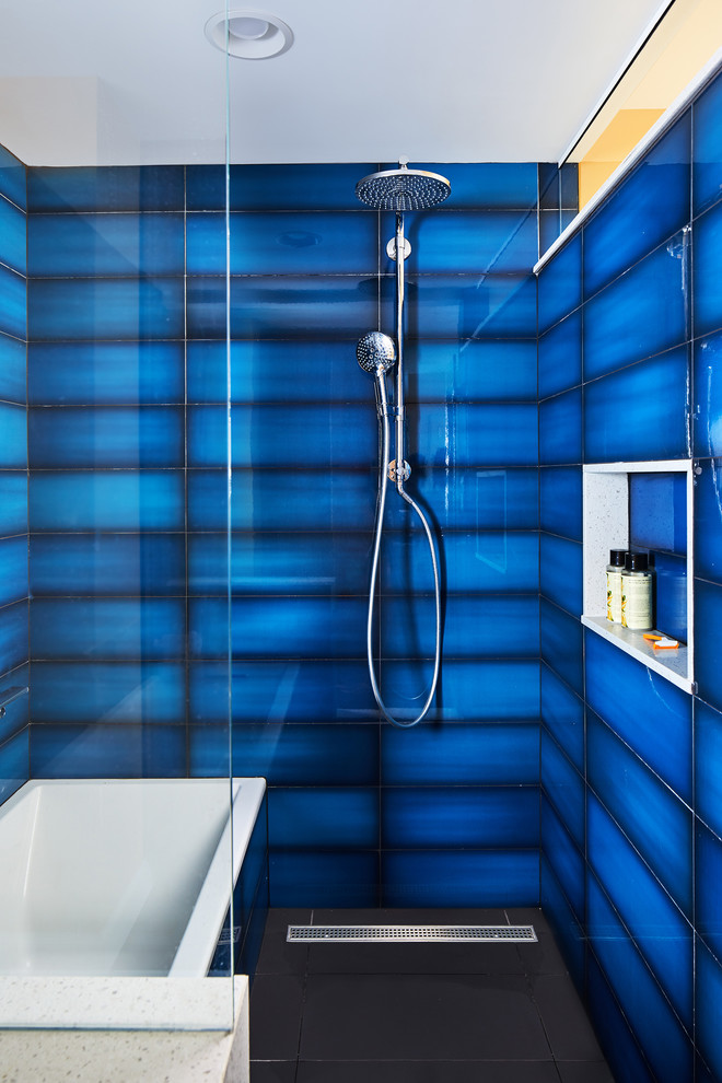 Inspiration for a contemporary wet room bathroom in DC Metro with blue tiles, an alcove bath and black floors.
