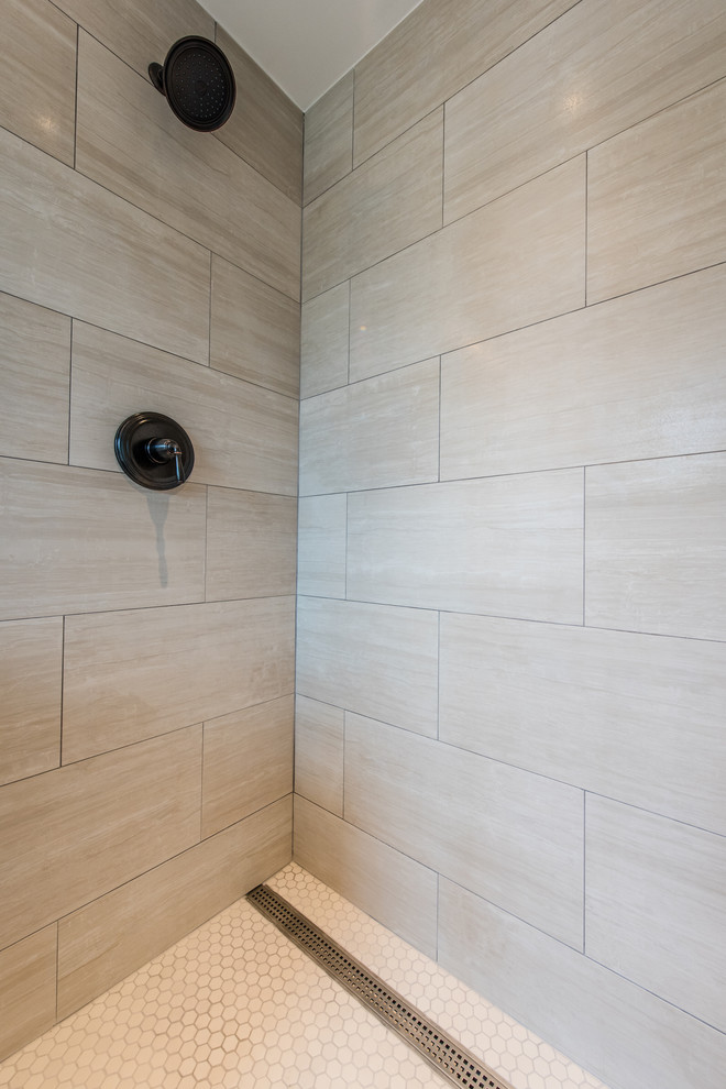 Design ideas for a small modern shower room bathroom in DC Metro with freestanding cabinets, medium wood cabinets, an alcove shower, a two-piece toilet, beige tiles, beige walls, ceramic flooring, quartz worktops and a submerged sink.