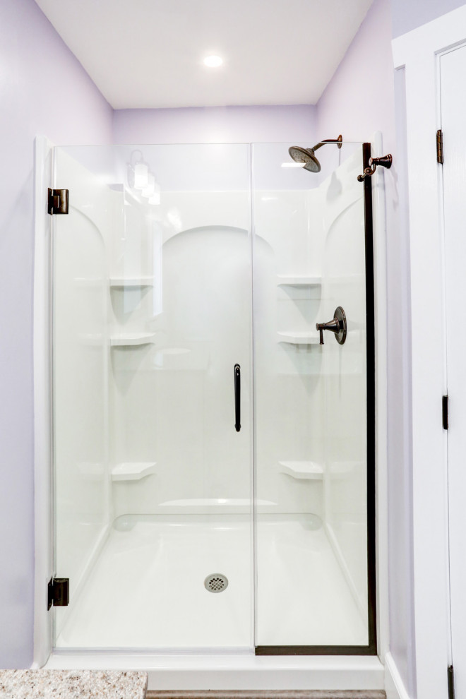 Inspiration for a medium sized classic ensuite bathroom in Other with beige cabinets, a freestanding bath, an alcove shower, purple walls, vinyl flooring, a submerged sink, marble worktops, brown floors, a hinged door, beige worktops, a single sink and a freestanding vanity unit.