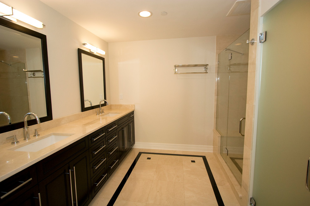 This is an example of a large traditional ensuite bathroom in Tampa with shaker cabinets, black cabinets, an alcove shower, ceramic tiles, beige walls, ceramic flooring and a submerged sink.
