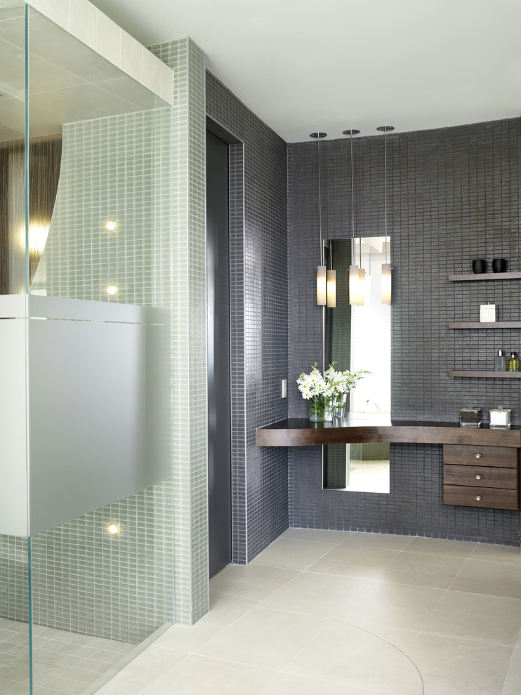 Photo of a large contemporary ensuite bathroom in Toronto with flat-panel cabinets, dark wood cabinets, wooden worktops, a built-in shower, brown tiles and porcelain flooring.