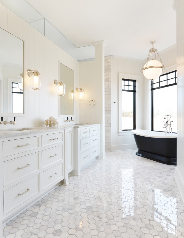 Inspiration for a large classic ensuite bathroom in Milwaukee with white cabinets, a freestanding bath, a double shower, white tiles, marble tiles, white walls, marble flooring, a submerged sink, marble worktops, grey floors, an open shower, grey worktops and recessed-panel cabinets.