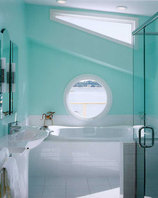 This is an example of a medium sized beach style ensuite bathroom in Boston with a built-in bath, an alcove shower, white tiles, metro tiles, blue walls, ceramic flooring and a pedestal sink.