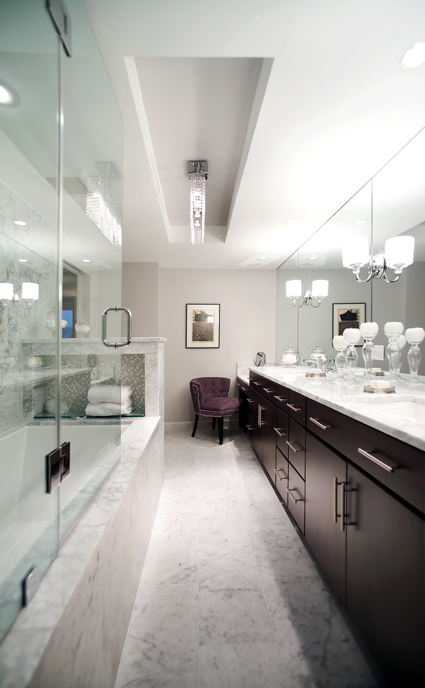 Photo of a classic bathroom in DC Metro with a submerged sink, flat-panel cabinets, dark wood cabinets, a submerged bath, a shower/bath combination and grey walls.
