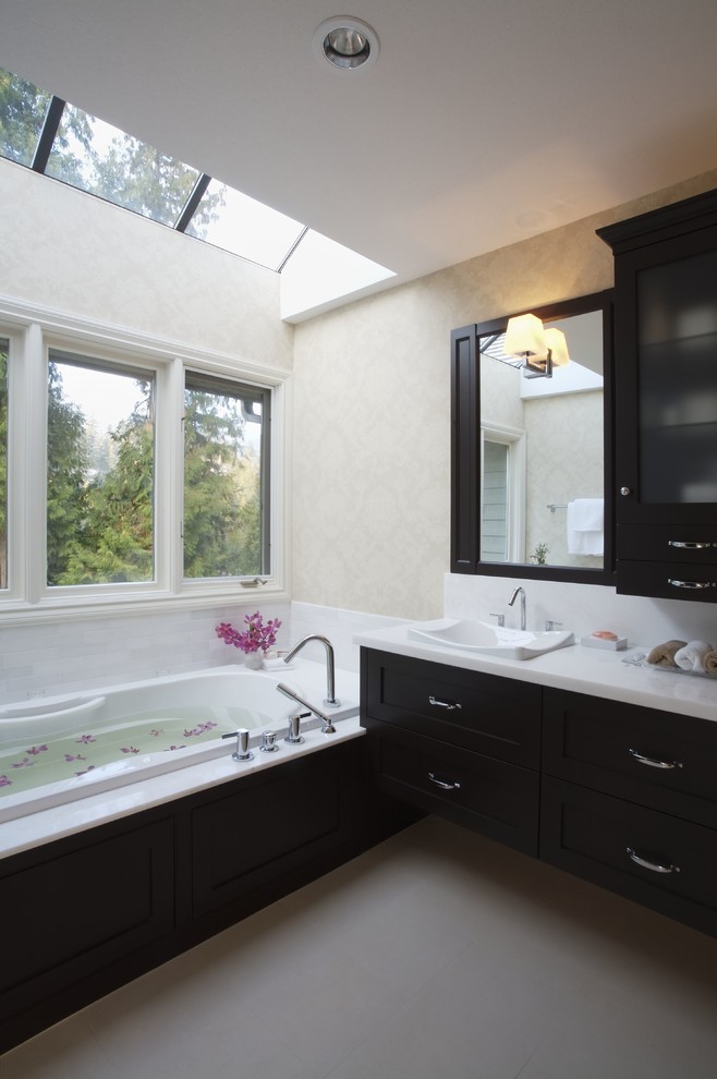 Design ideas for a classic bathroom in Vancouver with a built-in sink, dark wood cabinets, engineered stone worktops and a one-piece toilet.