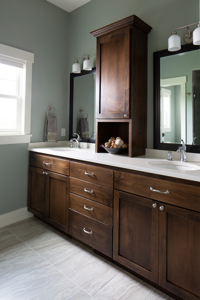 Medium sized classic ensuite bathroom in Milwaukee with beige tiles, ceramic tiles, ceramic flooring, beige floors, a hinged door, flat-panel cabinets, brown cabinets, a double shower, a submerged sink, engineered stone worktops and white worktops.