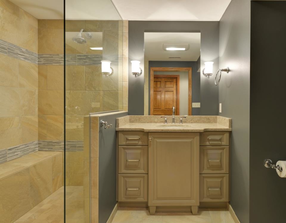 Inspiration for a timeless porcelain tile bathroom remodel in Milwaukee with raised-panel cabinets, green cabinets, an undermount sink and quartz countertops