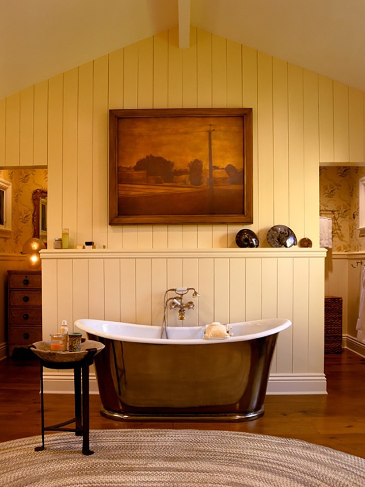 Freestanding bathtub - huge country medium tone wood floor freestanding bathtub idea in San Diego with furniture-like cabinets, distressed cabinets and marble countertops