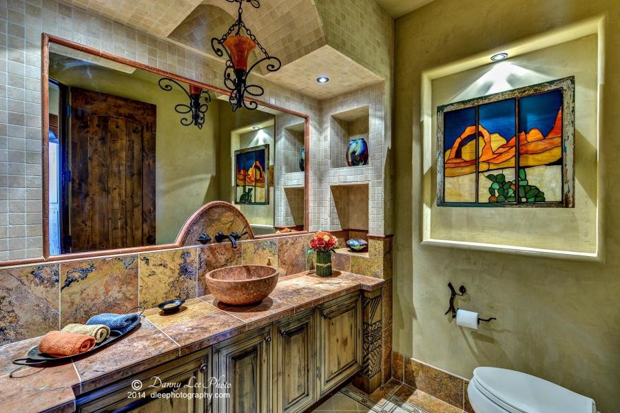 Mid-sized southwest master beige tile and stone tile ceramic tile bathroom photo in Salt Lake City with raised-panel cabinets, dark wood cabinets, a one-piece toilet, beige walls, a drop-in sink and soapstone countertops
