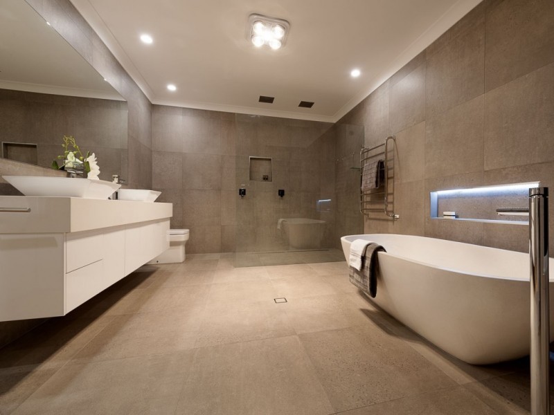 Design ideas for a medium sized contemporary ensuite bathroom in Brisbane with flat-panel cabinets, white cabinets, a freestanding bath, a corner shower, a one-piece toilet, grey tiles, cement tiles, grey walls, cement flooring, a vessel sink, grey floors and an open shower.