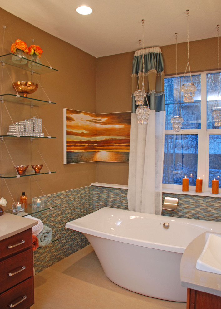 Mid-sized transitional master multicolored tile and glass tile bathroom photo in Denver with a drop-in sink, recessed-panel cabinets, medium tone wood cabinets, quartz countertops, a one-piece toilet and beige walls
