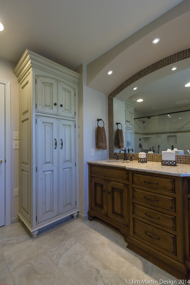 Large eclectic master multicolored tile and ceramic tile ceramic tile corner shower photo in Philadelphia with an undermount sink, raised-panel cabinets, distressed cabinets, quartzite countertops and a one-piece toilet