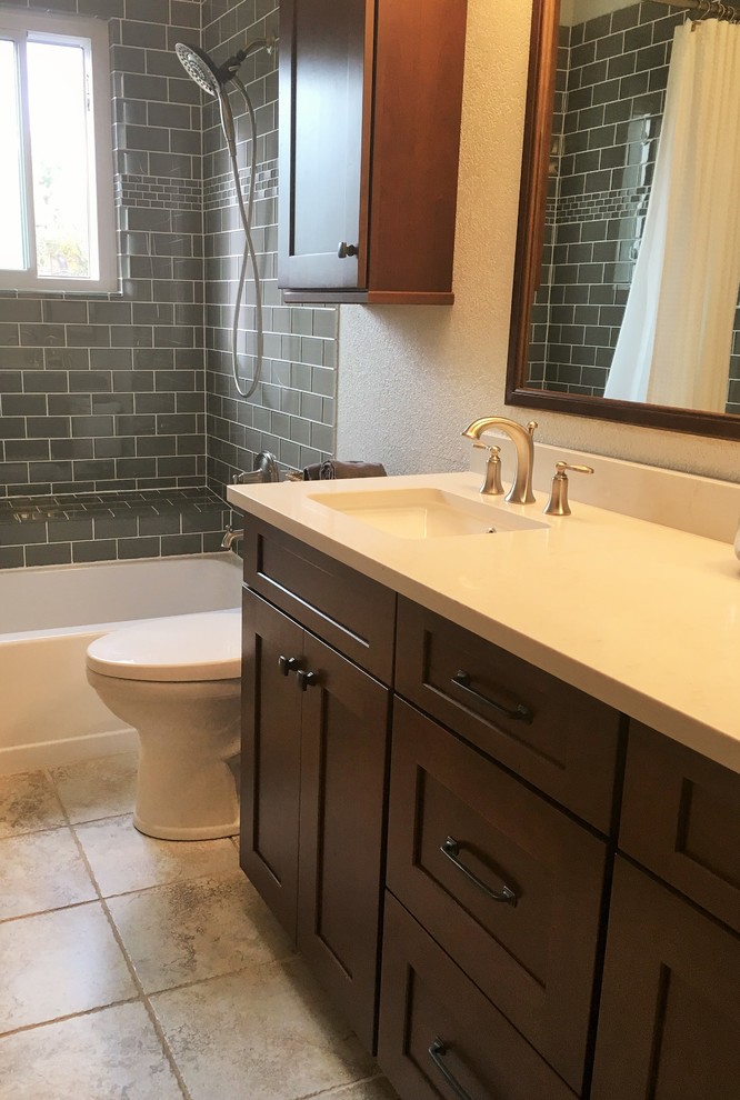 Design ideas for a medium sized traditional shower room bathroom in Denver with raised-panel cabinets, dark wood cabinets, a corner bath, a walk-in shower, a one-piece toilet, white tiles, metro tiles, grey walls, ceramic flooring, a built-in sink, soapstone worktops, beige floors and an open shower.
