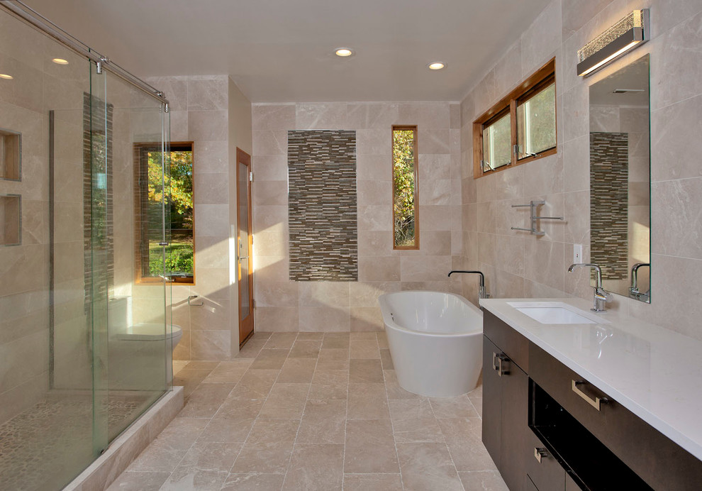 Bathroom - mid-sized zen master beige tile and limestone tile limestone floor bathroom idea in Omaha with flat-panel cabinets, brown cabinets, a one-piece toilet, beige walls and an undermount sink