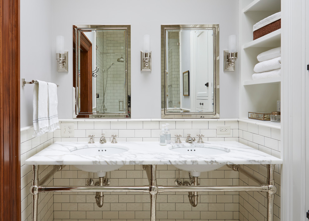Design ideas for a classic bathroom in Chicago with open cabinets, white walls and a submerged sink.