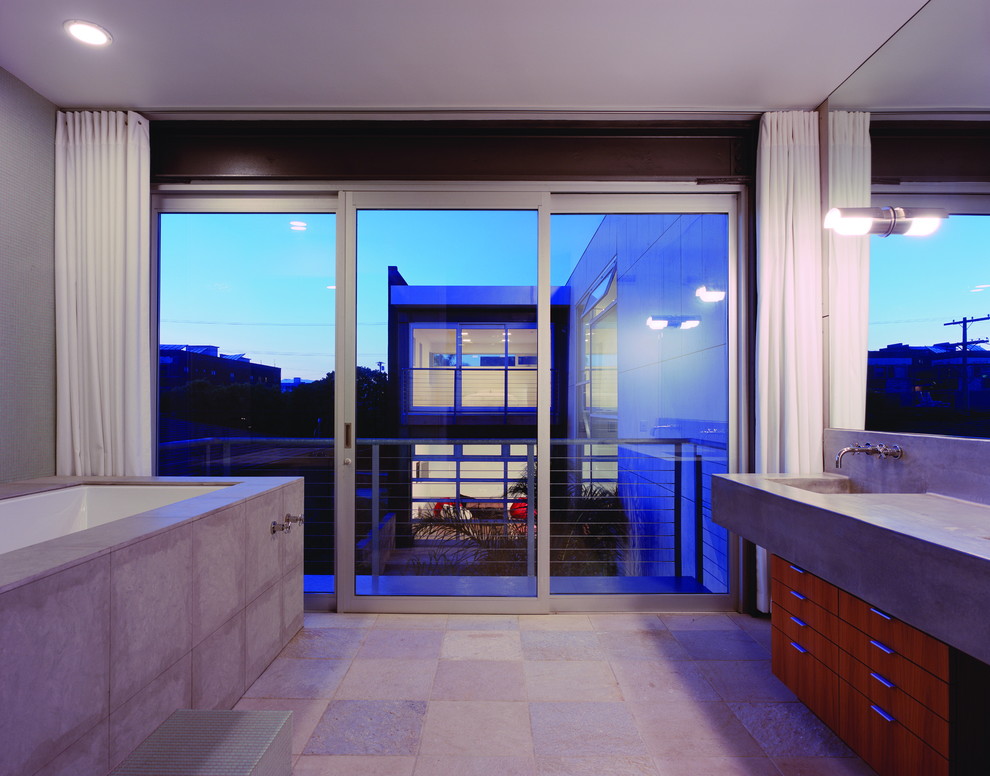 Diseño de cuarto de baño moderno con encimera de cemento
