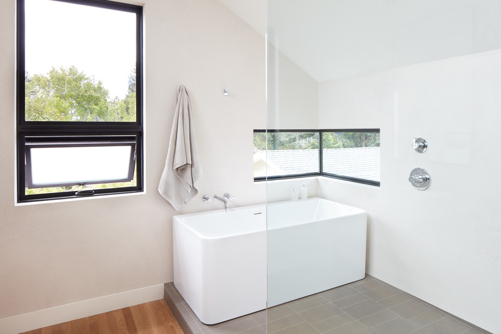 Design ideas for a large contemporary ensuite bathroom in San Francisco with freestanding cabinets, medium wood cabinets, a freestanding bath, a walk-in shower, white walls, light hardwood flooring, a vessel sink, wooden worktops, beige floors, an open shower and multi-coloured worktops.