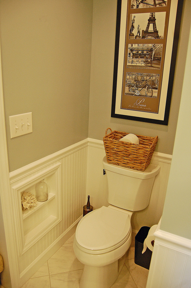 Example of a mid-sized eclectic gray tile and porcelain tile porcelain tile powder room design in Other with an undermount sink, shaker cabinets, white cabinets, granite countertops, a two-piece toilet and blue walls