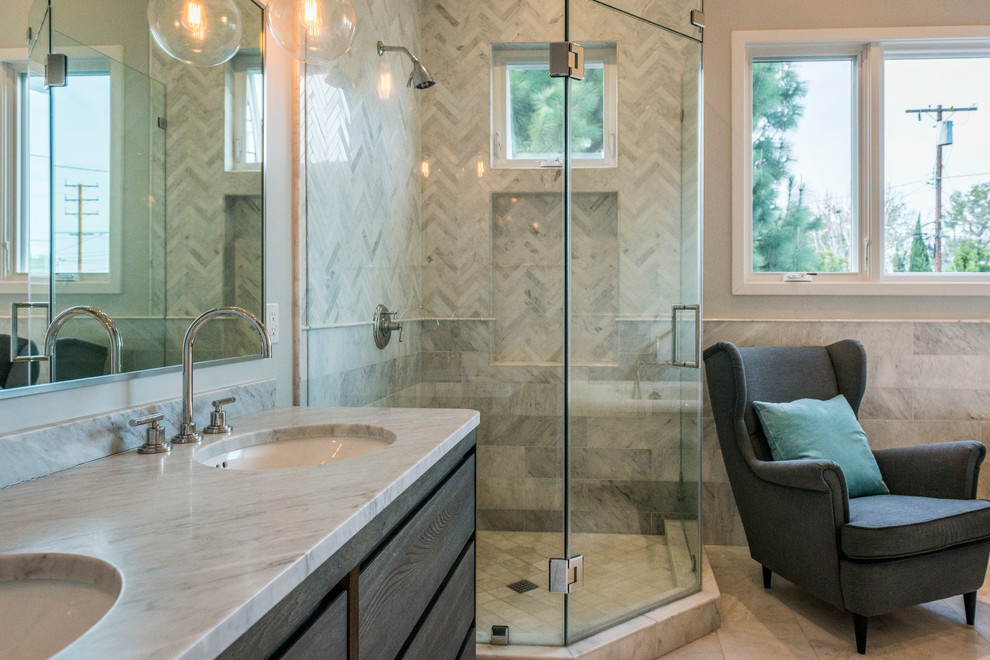 Inspiration for a large transitional master gray tile and marble tile marble floor and gray floor bathroom remodel in Los Angeles with flat-panel cabinets, gray cabinets, gray walls, an undermount sink, marble countertops, a hinged shower door and gray countertops