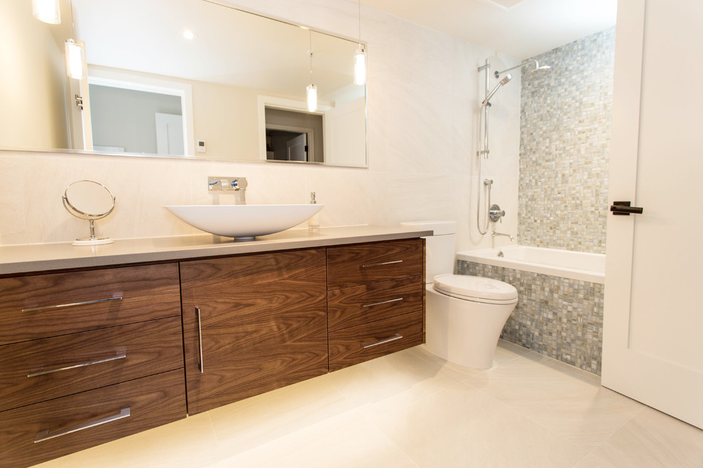 This is an example of a medium sized contemporary shower room bathroom in Vancouver with freestanding cabinets, medium wood cabinets, concrete worktops, a built-in bath, an alcove shower, blue tiles and mosaic tiles.