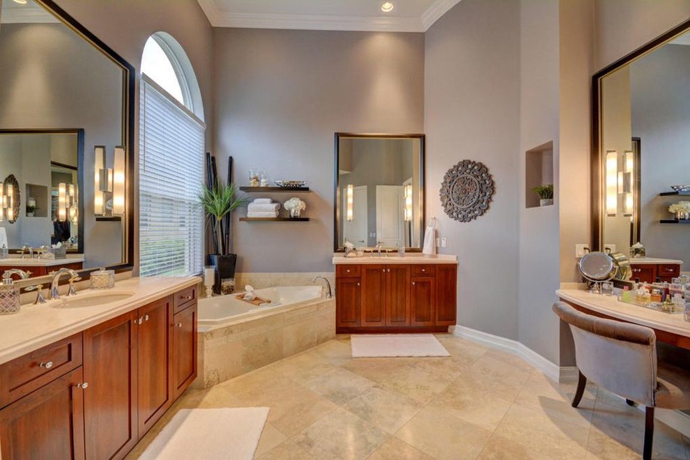 Bathroom - large transitional master beige tile and marble tile marble floor and beige floor bathroom idea in Miami with shaker cabinets, medium tone wood cabinets, a two-piece toilet, gray walls, an undermount sink, marble countertops and a hinged shower door