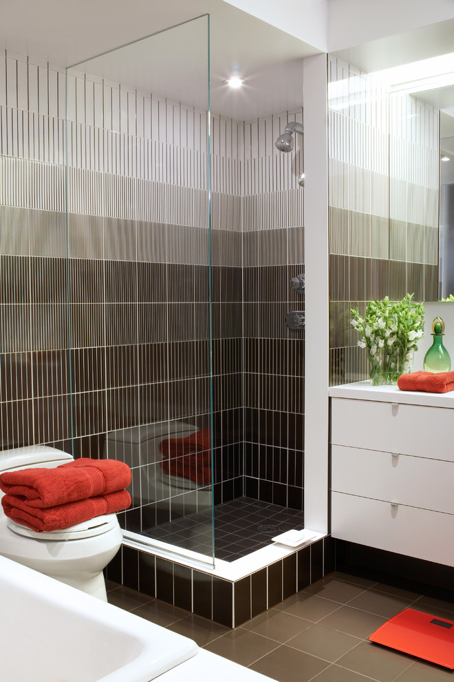 Inspiration for a contemporary bathroom in New York with flat-panel cabinets and white cabinets.