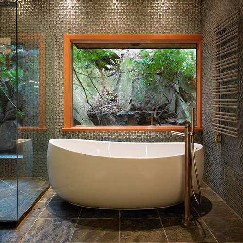 White Freestanding Tub Enhanced by Glass Mosaic Wall Tiles