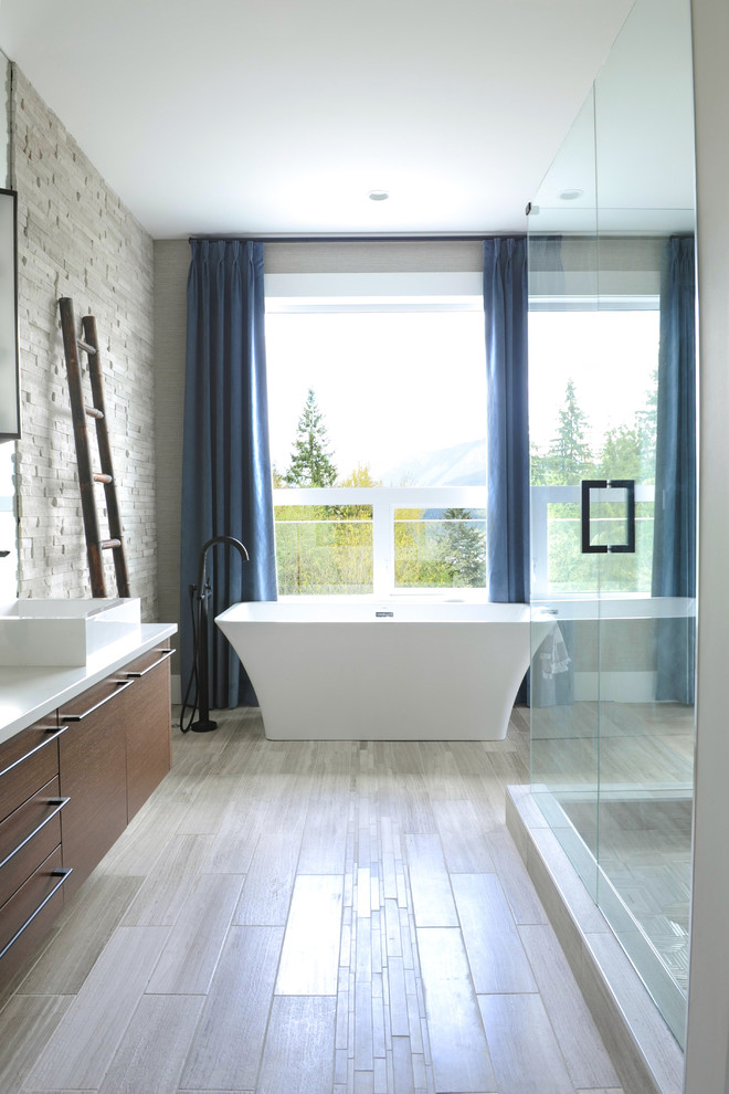 Inspiration for a contemporary ensuite bathroom in Other with flat-panel cabinets, brown cabinets, a freestanding bath, a corner shower, white walls, a vessel sink, solid surface worktops and a hinged door.