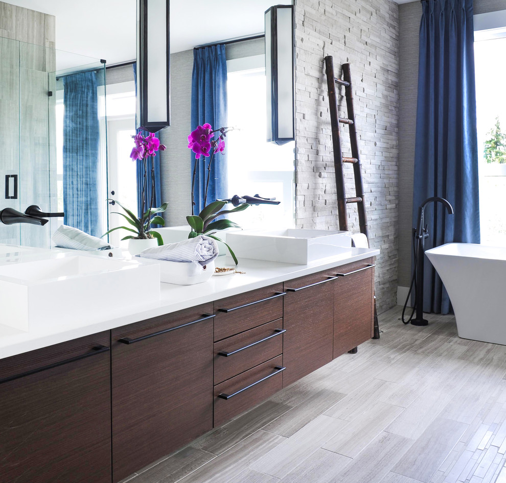 Contemporary ensuite bathroom in Other with flat-panel cabinets, brown cabinets, a freestanding bath, a corner shower, white walls, a vessel sink, solid surface worktops and a hinged door.