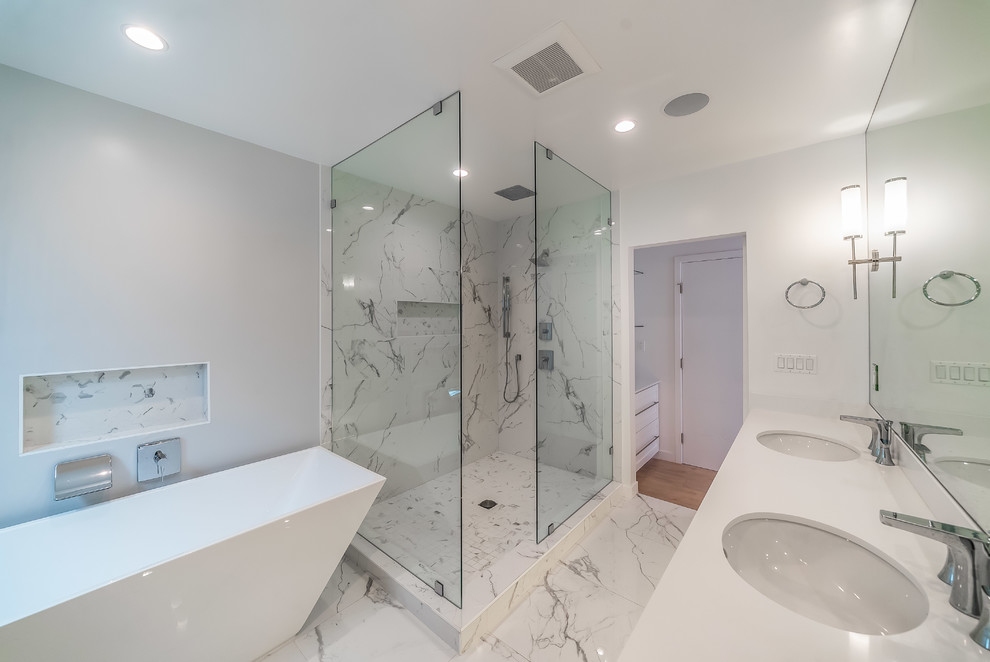 Bathroom - large contemporary master multicolored tile and porcelain tile porcelain tile and multicolored floor bathroom idea in Los Angeles with shaker cabinets, white cabinets, a one-piece toilet, white walls, an undermount sink, quartz countertops, a hinged shower door and white countertops
