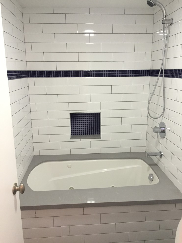 Inspiration for a medium sized traditional ensuite bathroom in Los Angeles with a submerged bath, a shower/bath combination, blue tiles, white tiles and metro tiles.