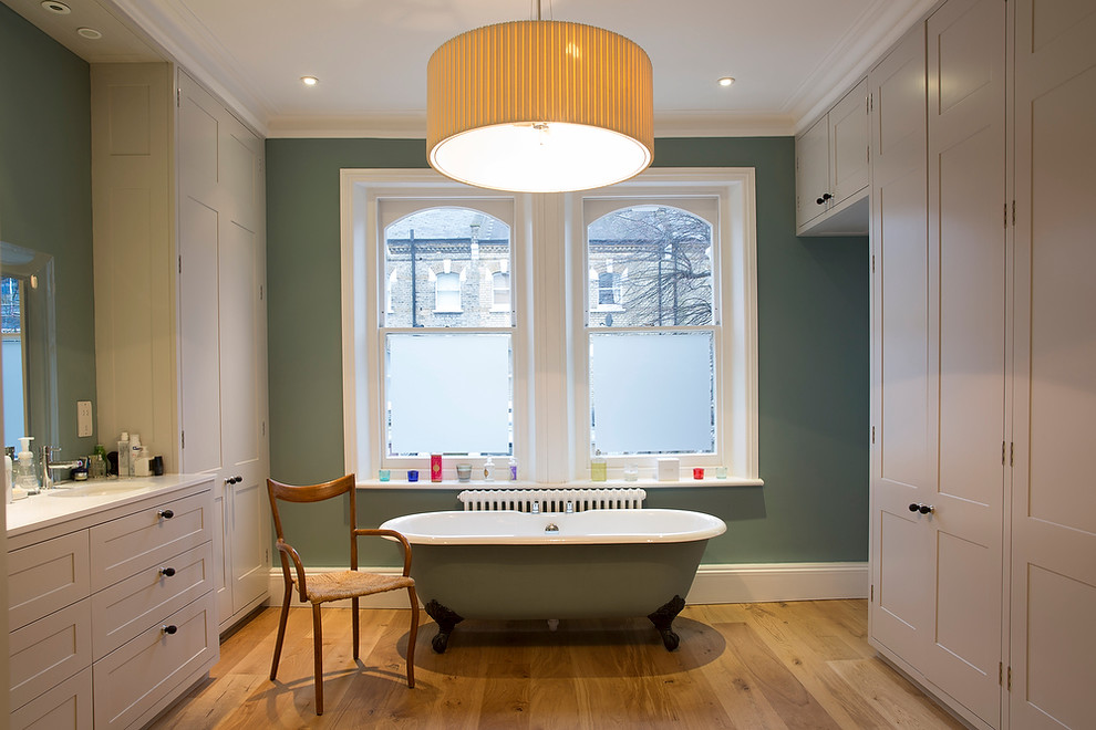 Design ideas for a large traditional ensuite bathroom in London with a submerged sink, shaker cabinets, grey cabinets, a claw-foot bath and green walls.