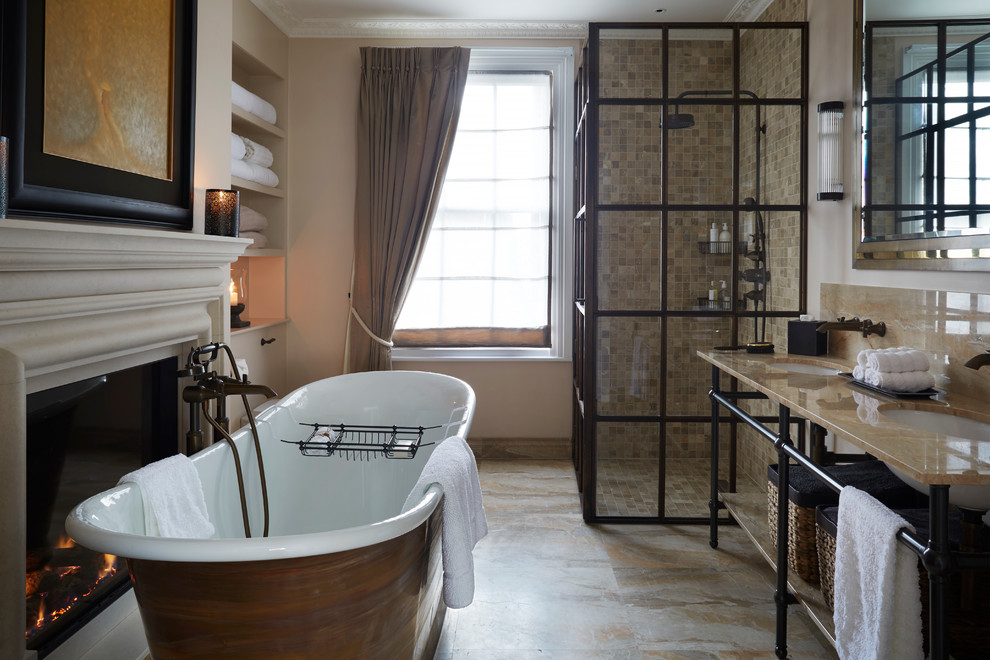 Foto di una stanza da bagno padronale chic con lavabo sottopiano, top in marmo, vasca freestanding, doccia ad angolo, piastrelle beige e pavimento in marmo