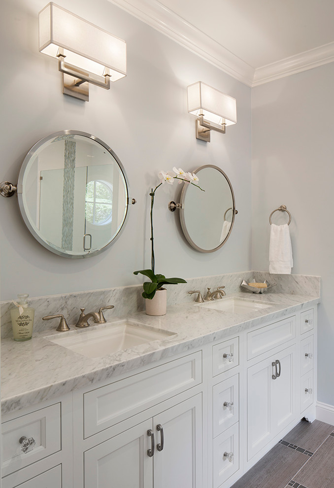 Example of a mid-sized transitional bathroom design in San Francisco with an undermount sink, recessed-panel cabinets, white cabinets and gray walls