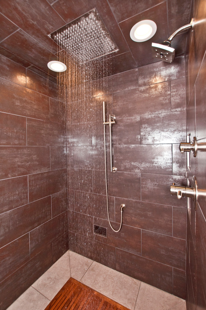 Doorless shower - large industrial master beige tile and porcelain tile porcelain tile doorless shower idea in Nashville with recessed-panel cabinets, dark wood cabinets, a two-piece toilet, beige walls, an undermount sink and concrete countertops